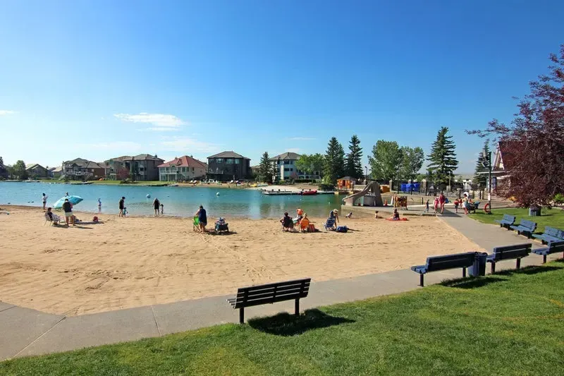 The community beach and park area at Arbour Lake, Calgary’s premier lake neighborhood in the NW.