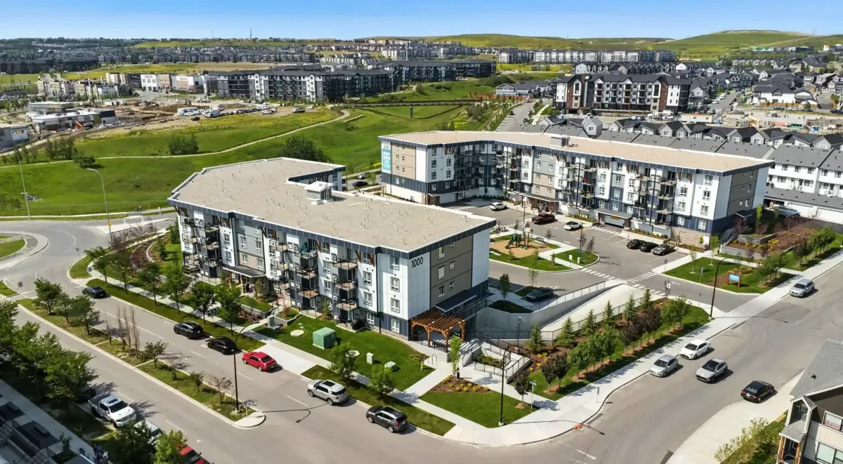 Modern commercial plaza and surrounding residential areas in the Sage Hill community.