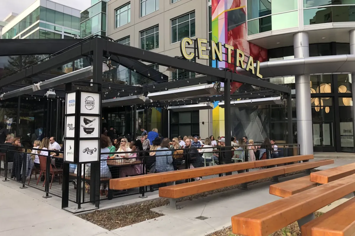 Modern outdoor patio and dining area at Central Taps + Food in Calgary.