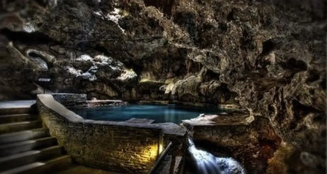 A gondola cabin ascending Sulphur Mountain with sweeping views of the Canadian Rockies.