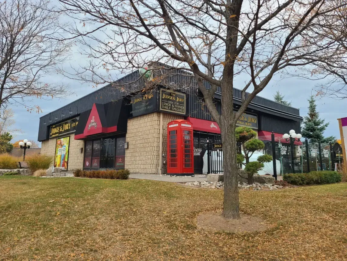The outdoor patio at The Judge and Jury Burlington, providing a popular social setting for summer dining on Walkers Line.