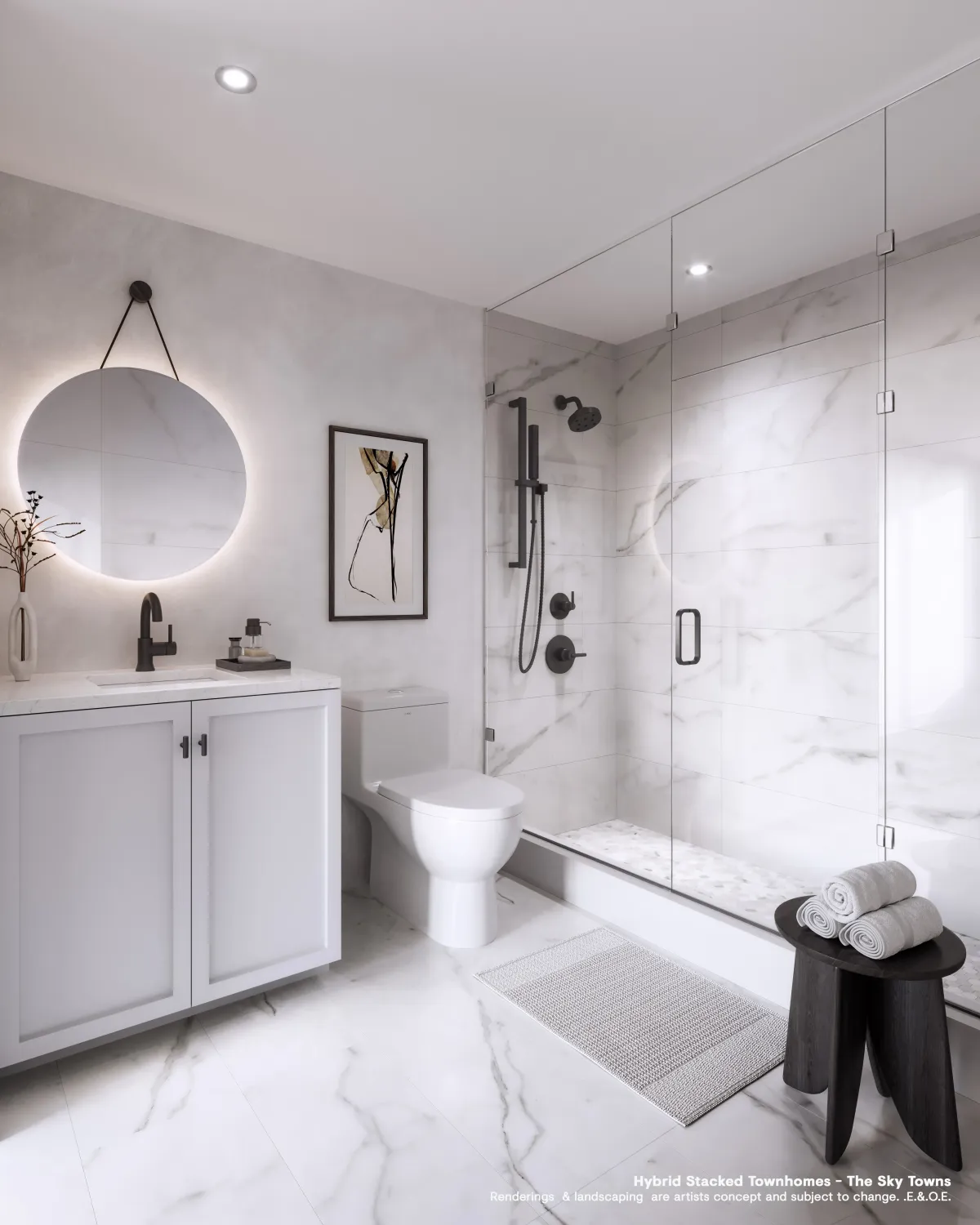Luxury bathroom ensuite with glass-enclosed shower and modern tiling at Westshore townhomes.