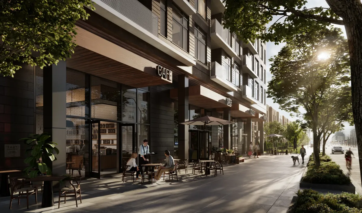 Exterior view of BLVD. Q mid-rise building featuring ground-level retail and landscaped streetscape.