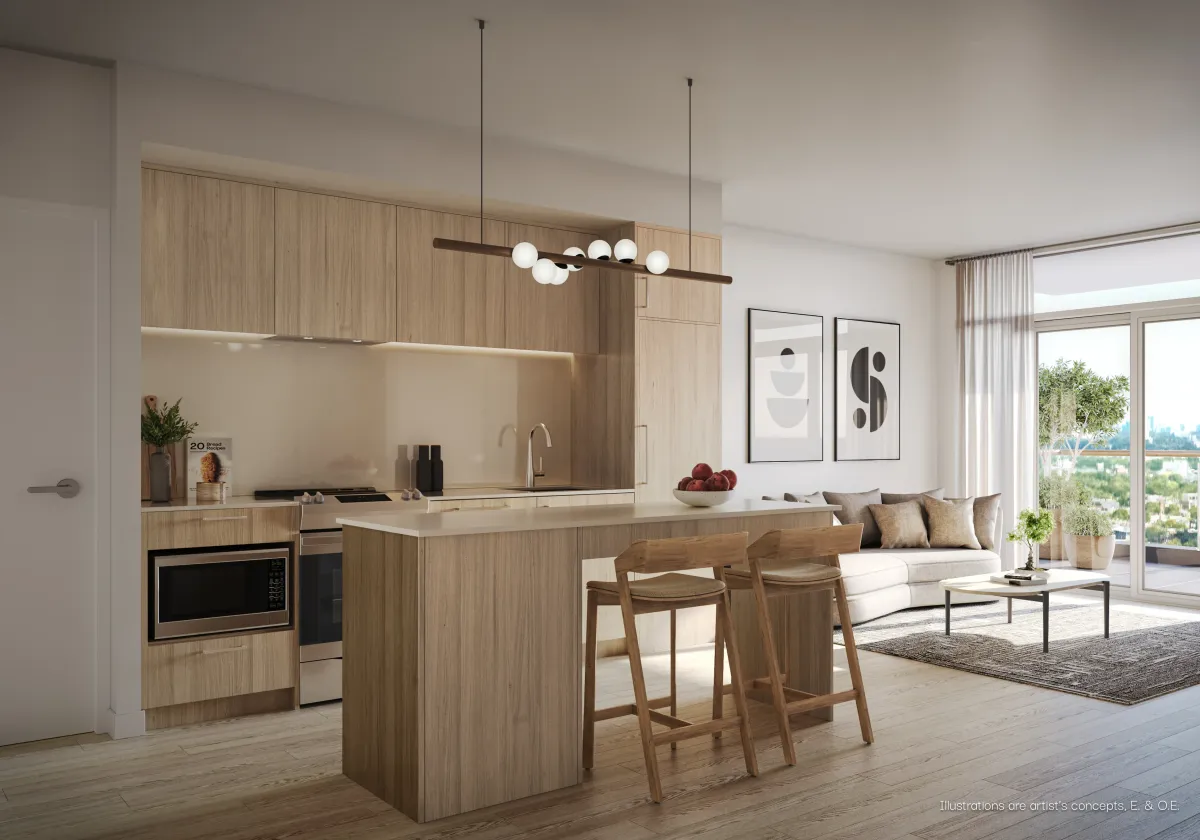 Stylish kitchen featuring a large wood-toned island and contemporary finishes at 935 The Queensway.