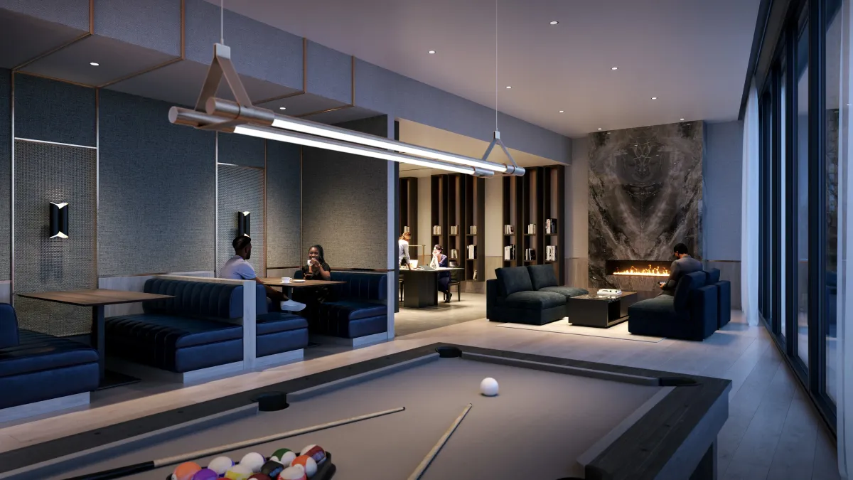 Sophisticated social lounge with a pool table and fireplace for residents at 5251 Dundas St W.