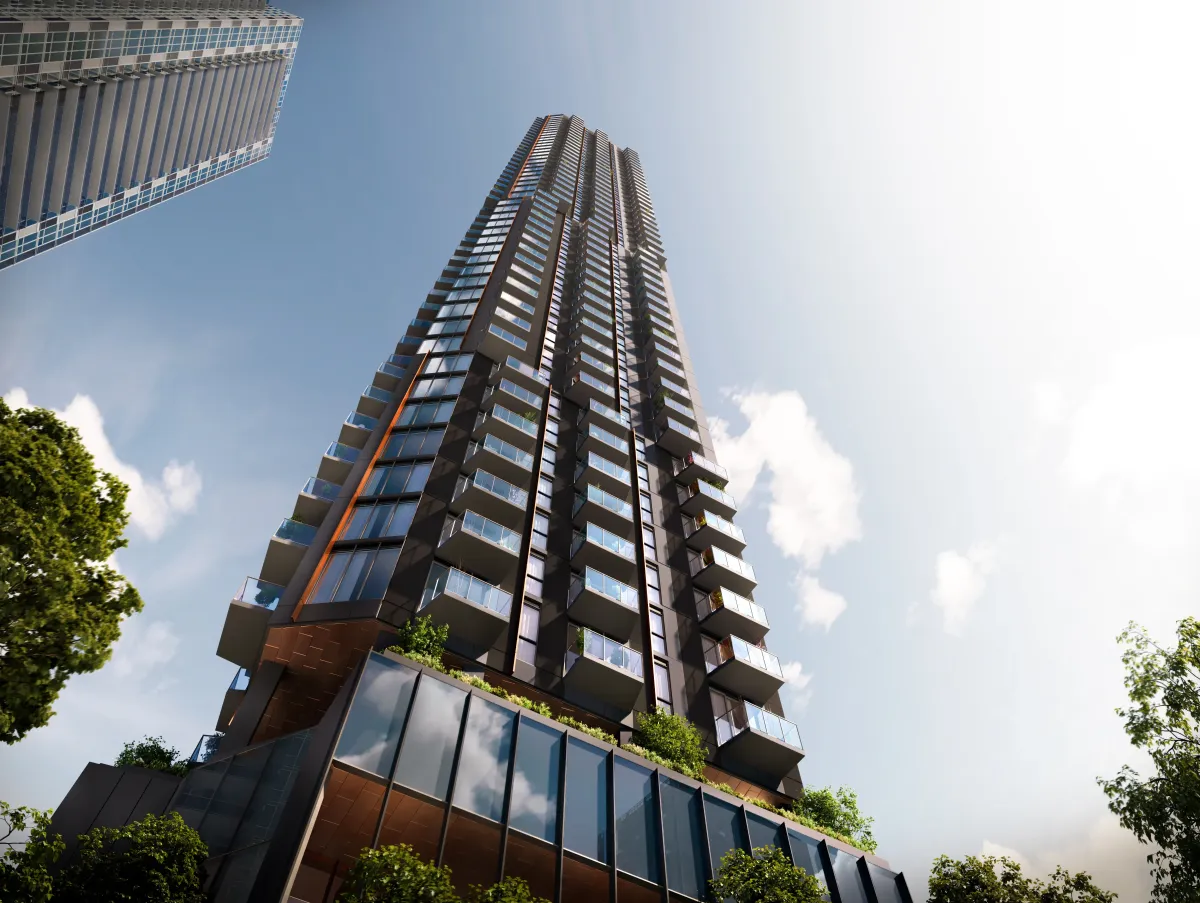 Architectural low-angle view of the Kipling Station Condos tower and ground-floor retail.