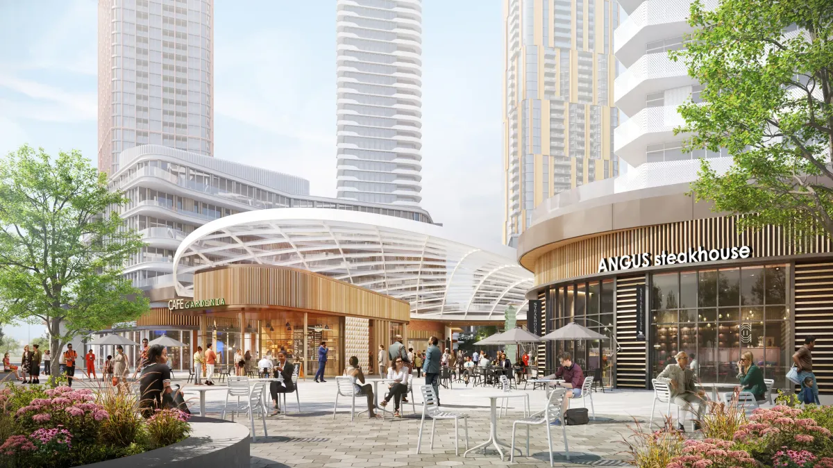 Lively central community plaza with outdoor seating and retail at The Clove.