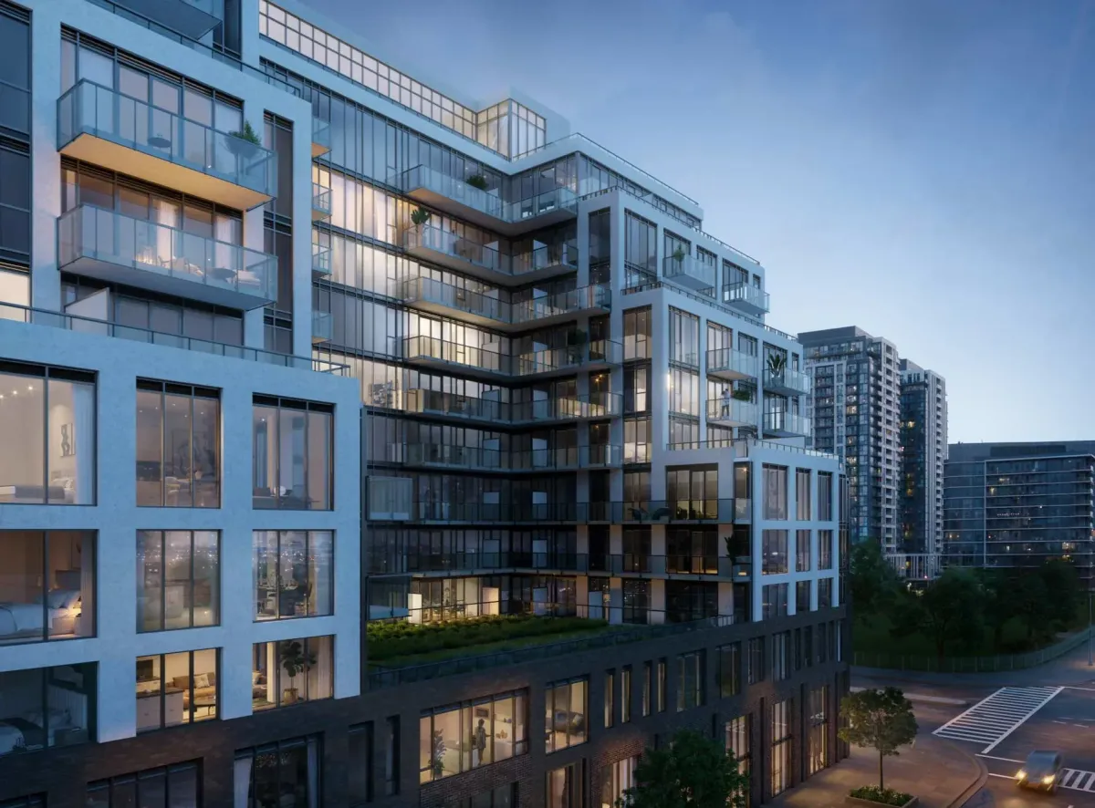 Dusk view of Joya Condos exterior highlighting the tiered terrace architecture and modern glass facade.