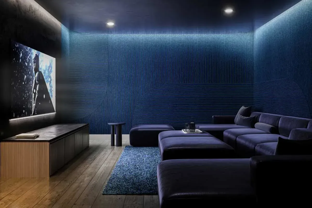 Private resident media room and theatre lounge with atmospheric lighting and comfortable seating at Joya Condos.