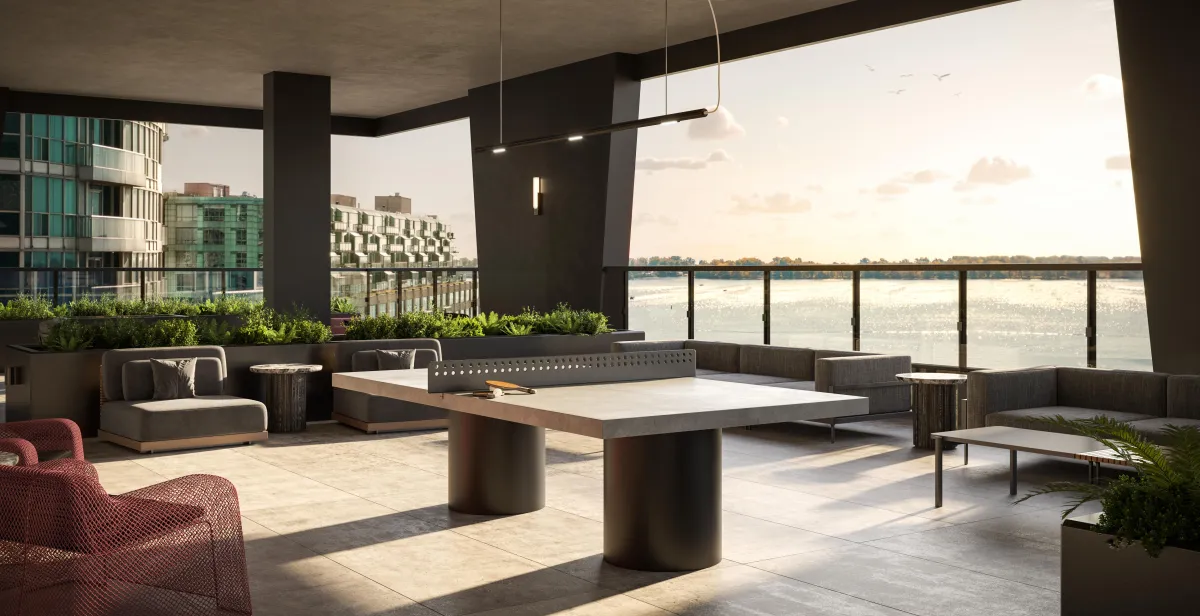 Outdoor amenity terrace featuring lounge seating and a ping-pong table at Q Tower.