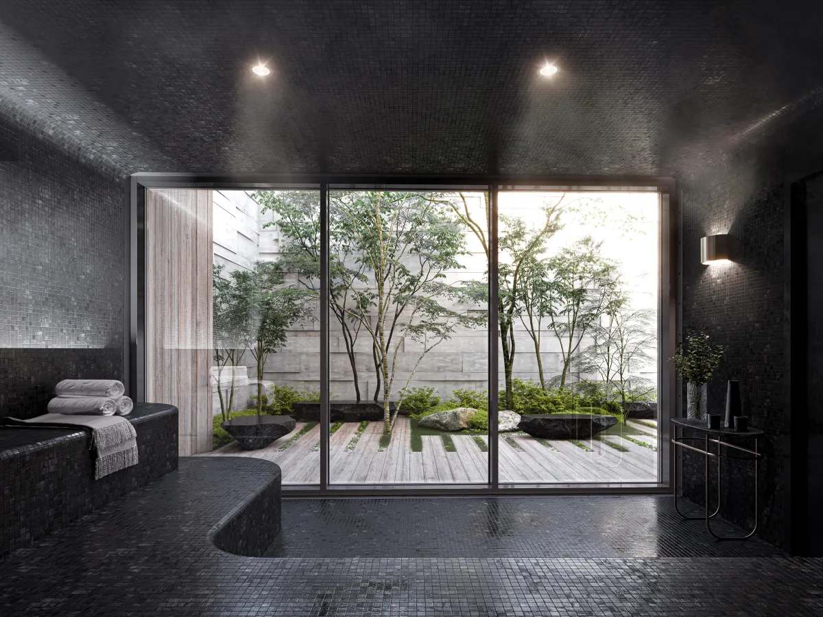 A dark, sophisticated indoor spa and wellness area with garden views at One Delisle Condos.