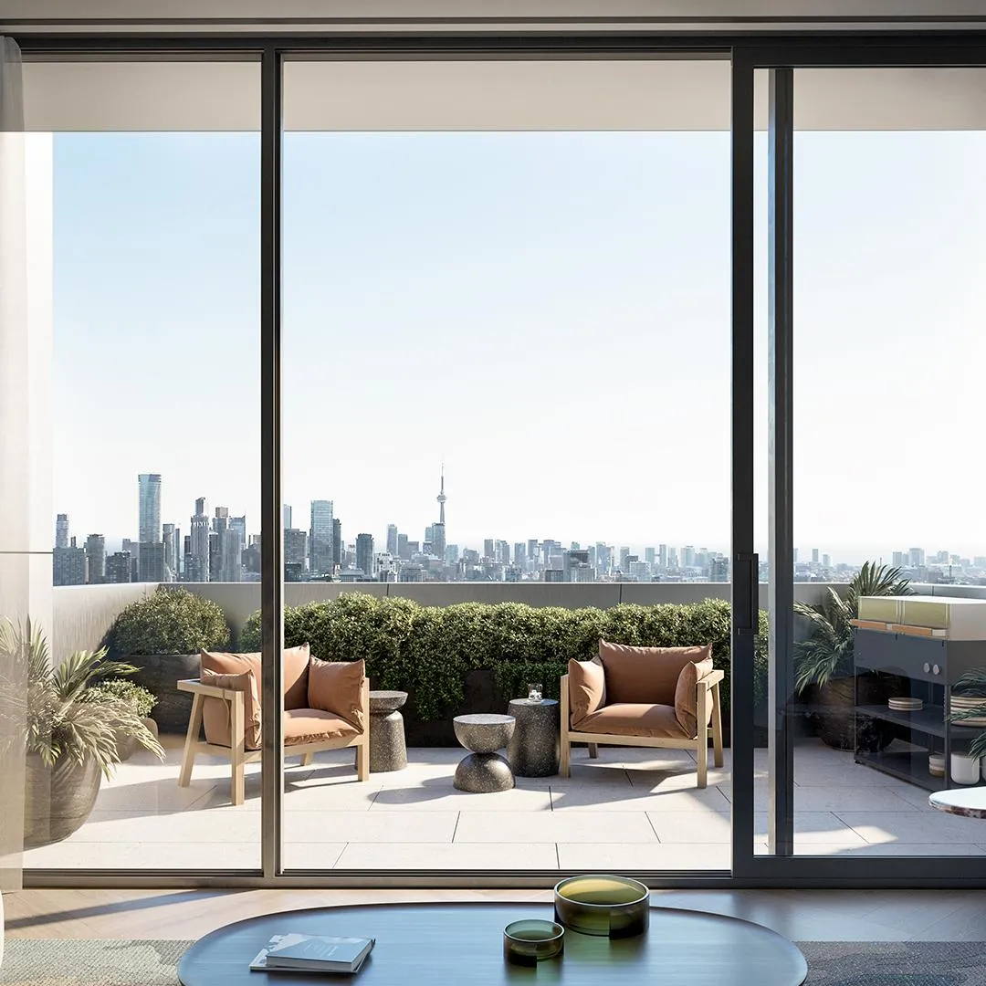 Close-up of a private balcony featuring lush greenery and lounge seating at One Delisle.