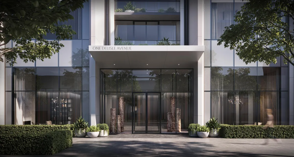 The grand ground-level entrance and retail podium of One Delisle Condos.