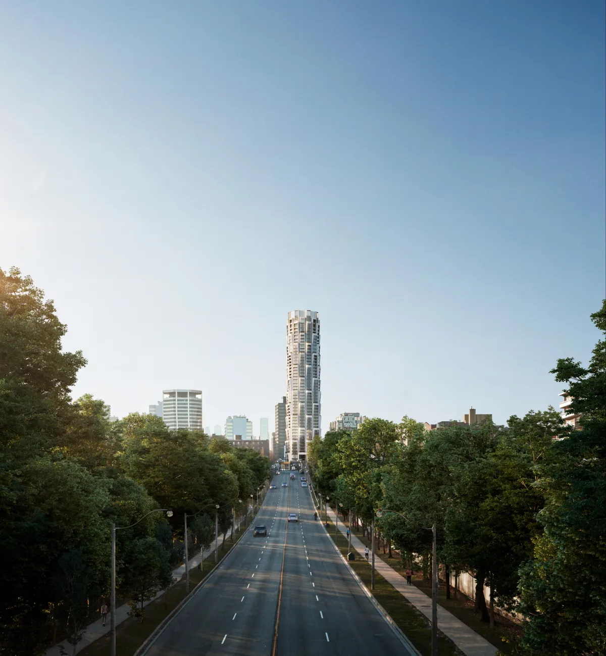 Aerial view of the iconic One Delisle tower rising above the tree-lined Yonge and St. Clair area.