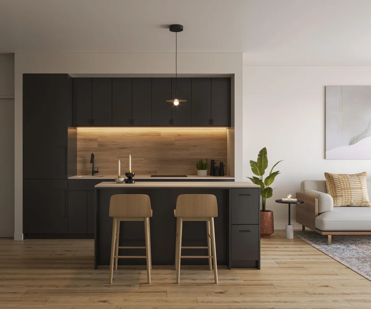 Sophisticated suite kitchen with matte charcoal cabinetry and a large waterfall island at Westbend.