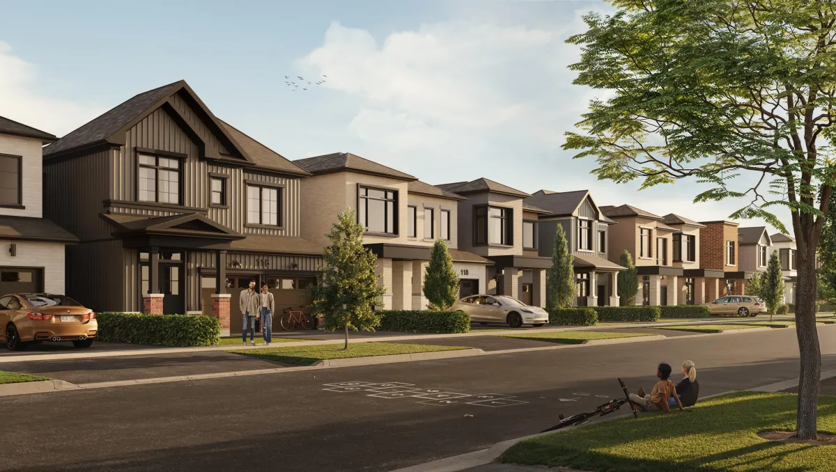 Streetscape view of the Wild Indigo master-planned community in Breslau showing modern detached homes and townhomes.