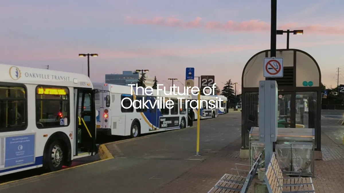 A new green and white Oakville Transit electric bus driving through North Oakville.
