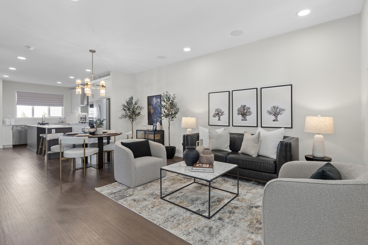 High-end kitchen with integrated appliances and elegant dining space at 9Hundred Condos.