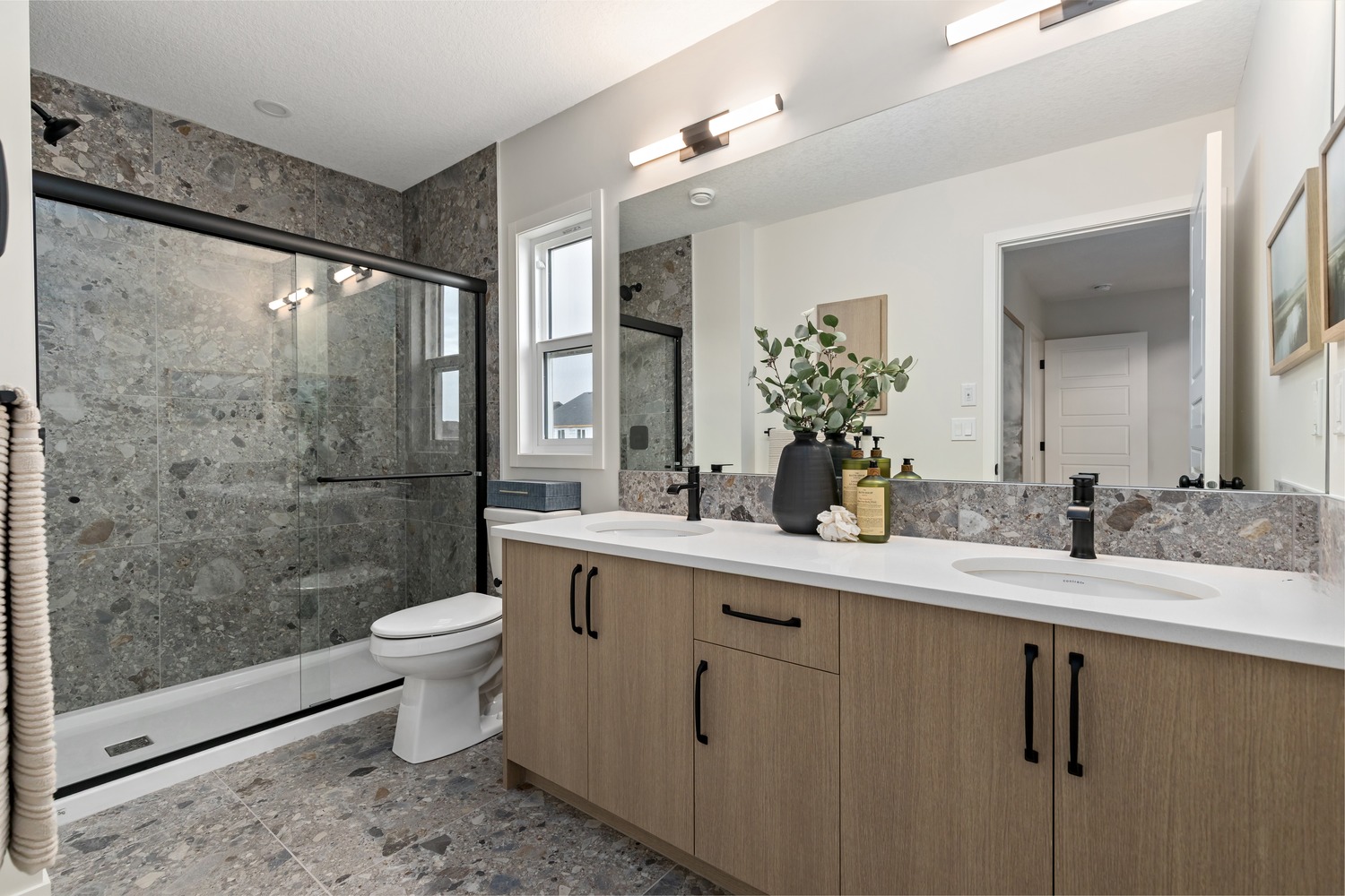 High-end kitchen with integrated appliances and elegant dining space at 9Hundred Condos.
