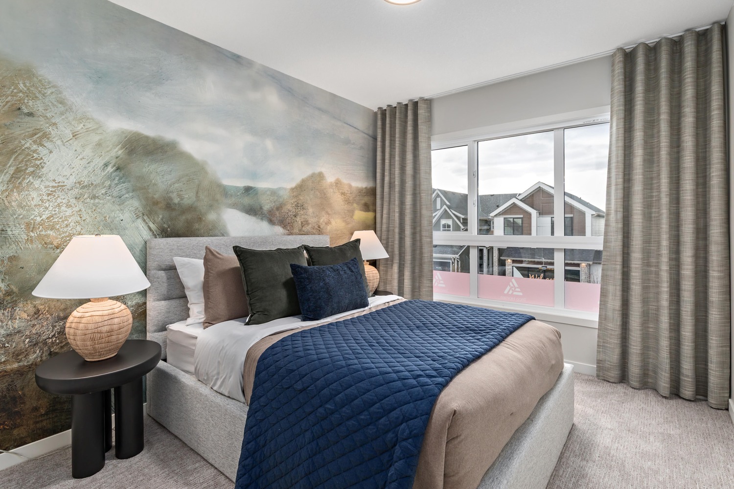 Modern open-concept living and dining area with floor-to-ceiling windows at 9Hundred Condos.