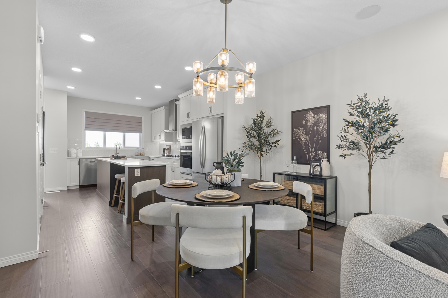 Modern open-concept living and dining area with floor-to-ceiling windows at 9Hundred Condos.
