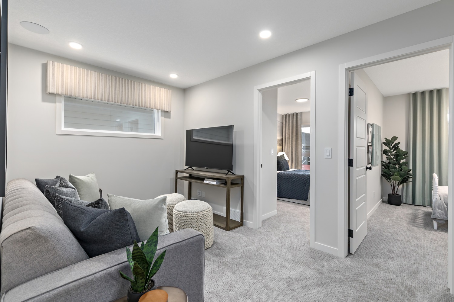 High-end kitchen with integrated appliances and elegant dining space at 9Hundred Condos.