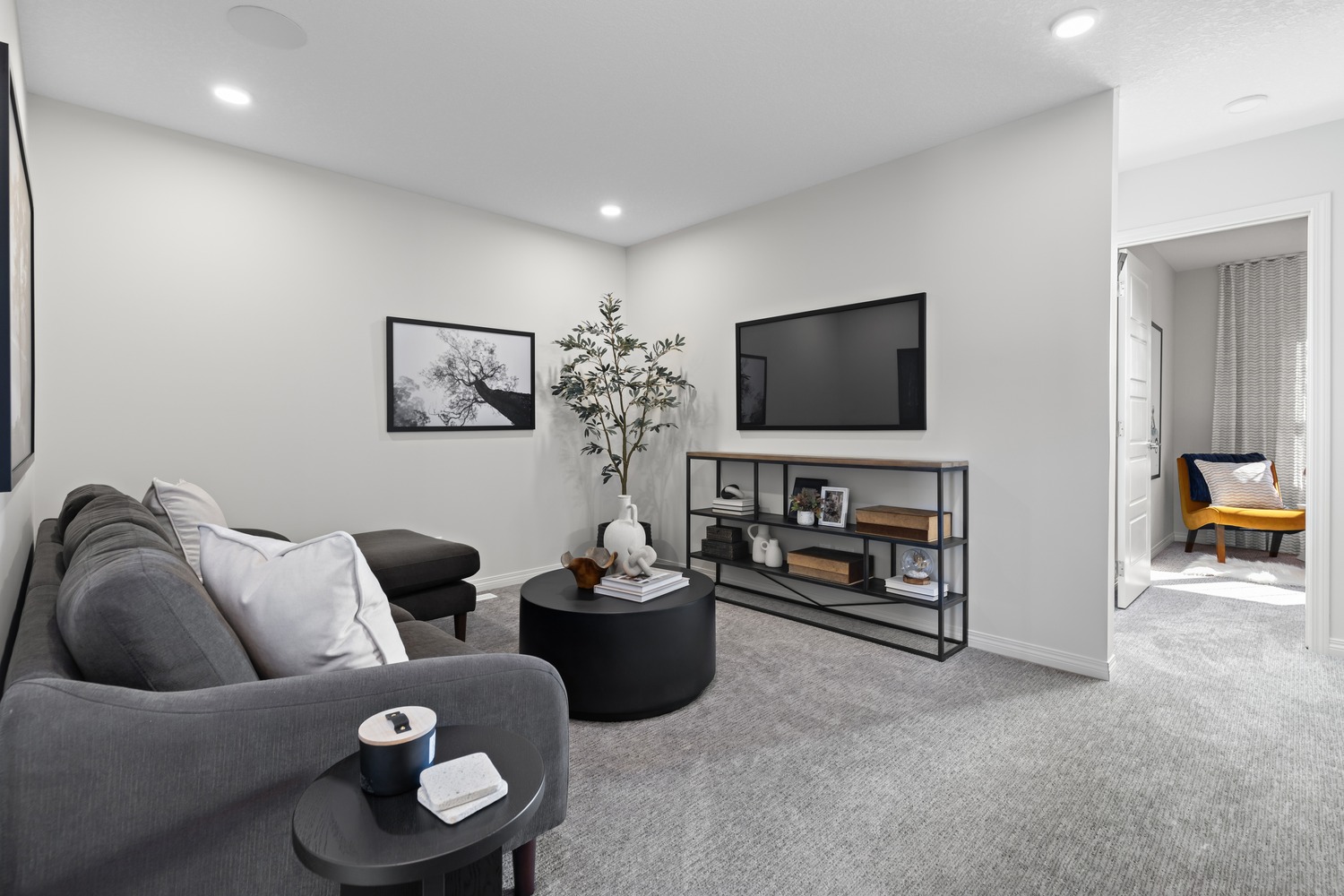 Modern open-concept living and dining area with floor-to-ceiling windows at 9Hundred Condos.