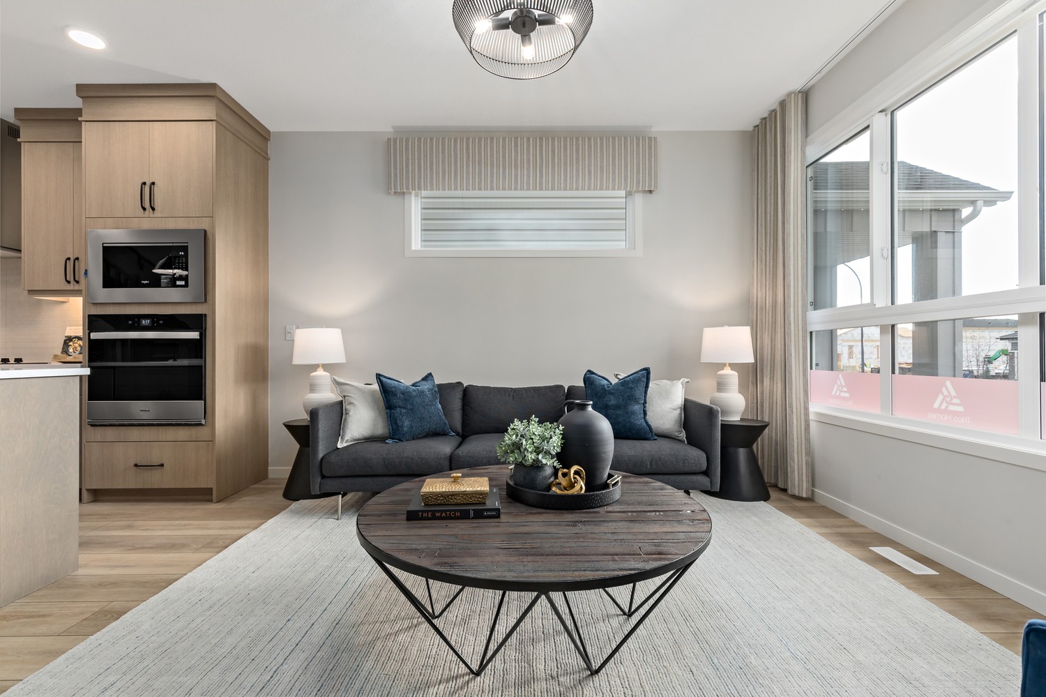 Bright suite interior featuring contemporary finishes and panoramic city views at 9Hundred.
