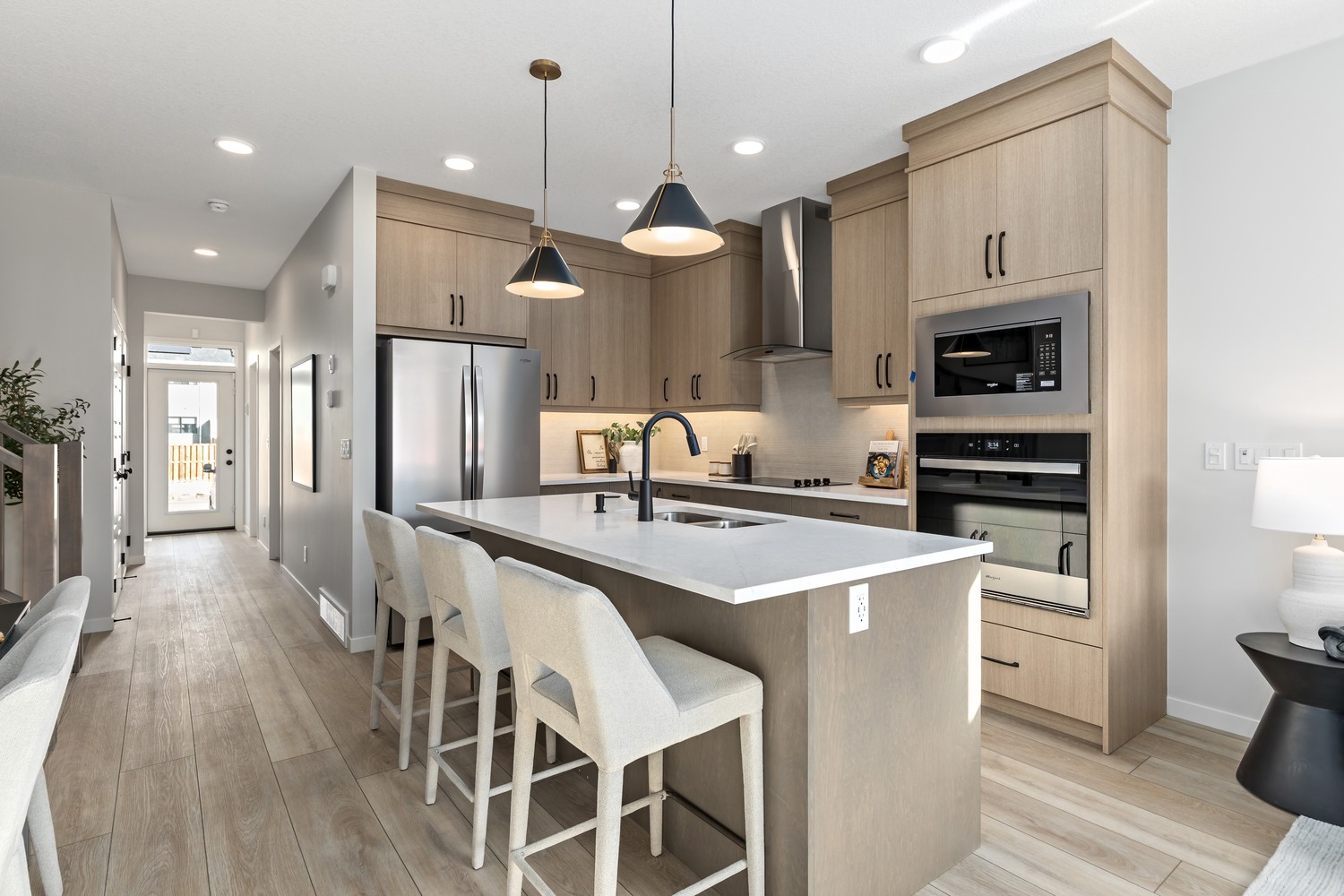 Bright suite interior featuring contemporary finishes and panoramic city views at 9Hundred.