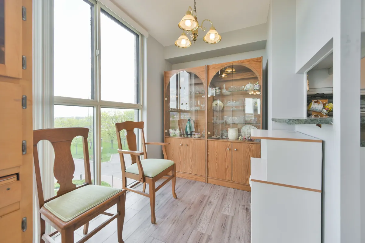 Dining space featuring large windows and views of the surrounding Rexdale area.