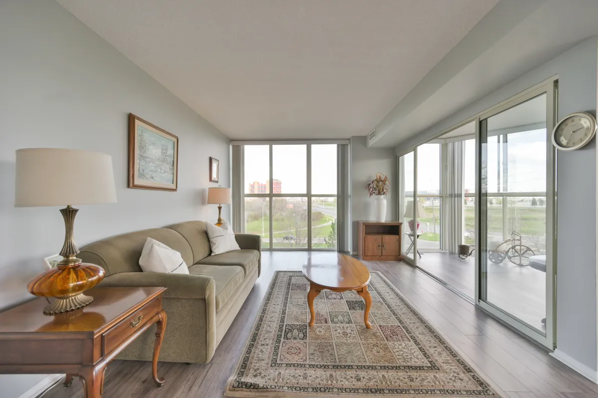 Sun-filled living room featuring large windows and panoramic views.