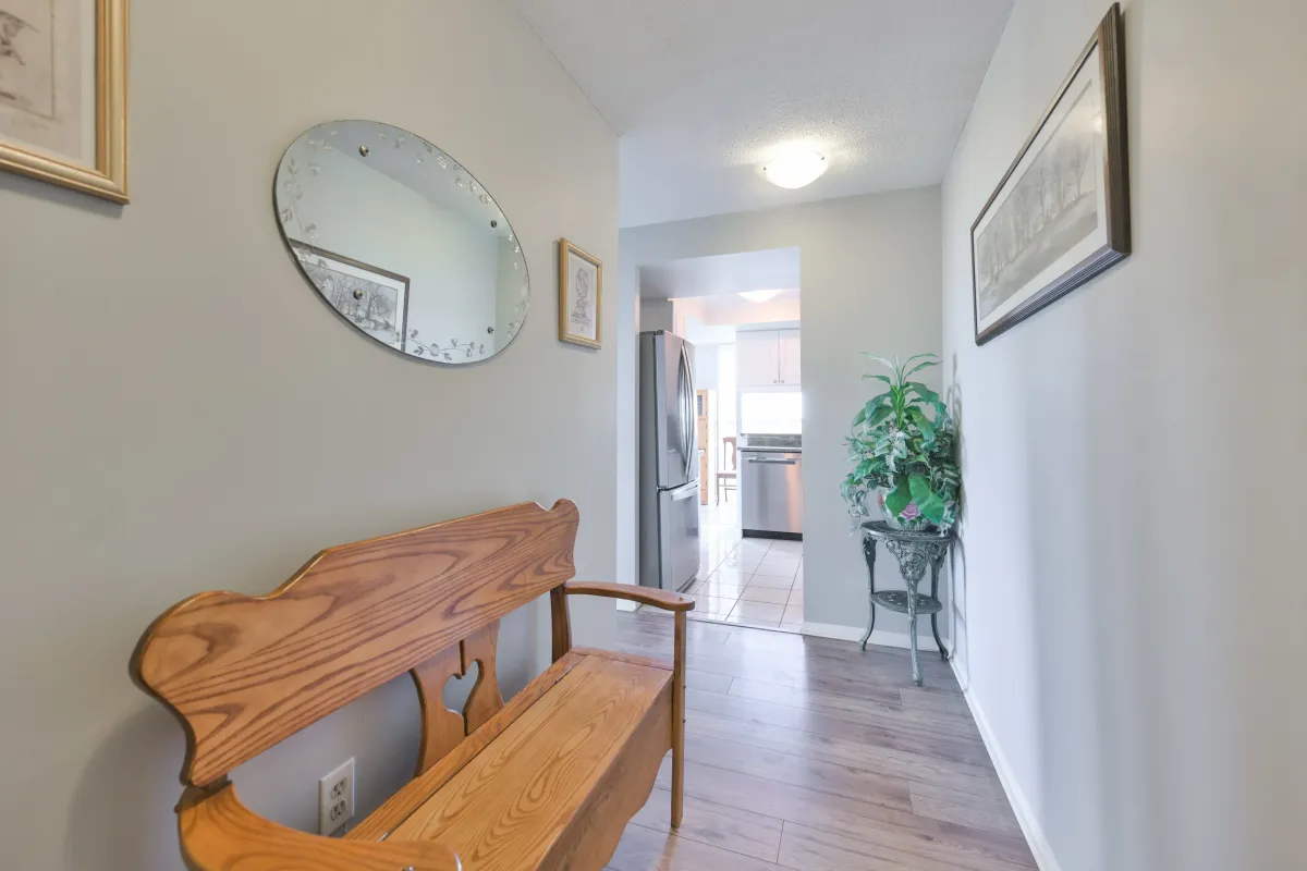 Interior hallway leading into a bright kitchen at 600 Rexdale Blvd.