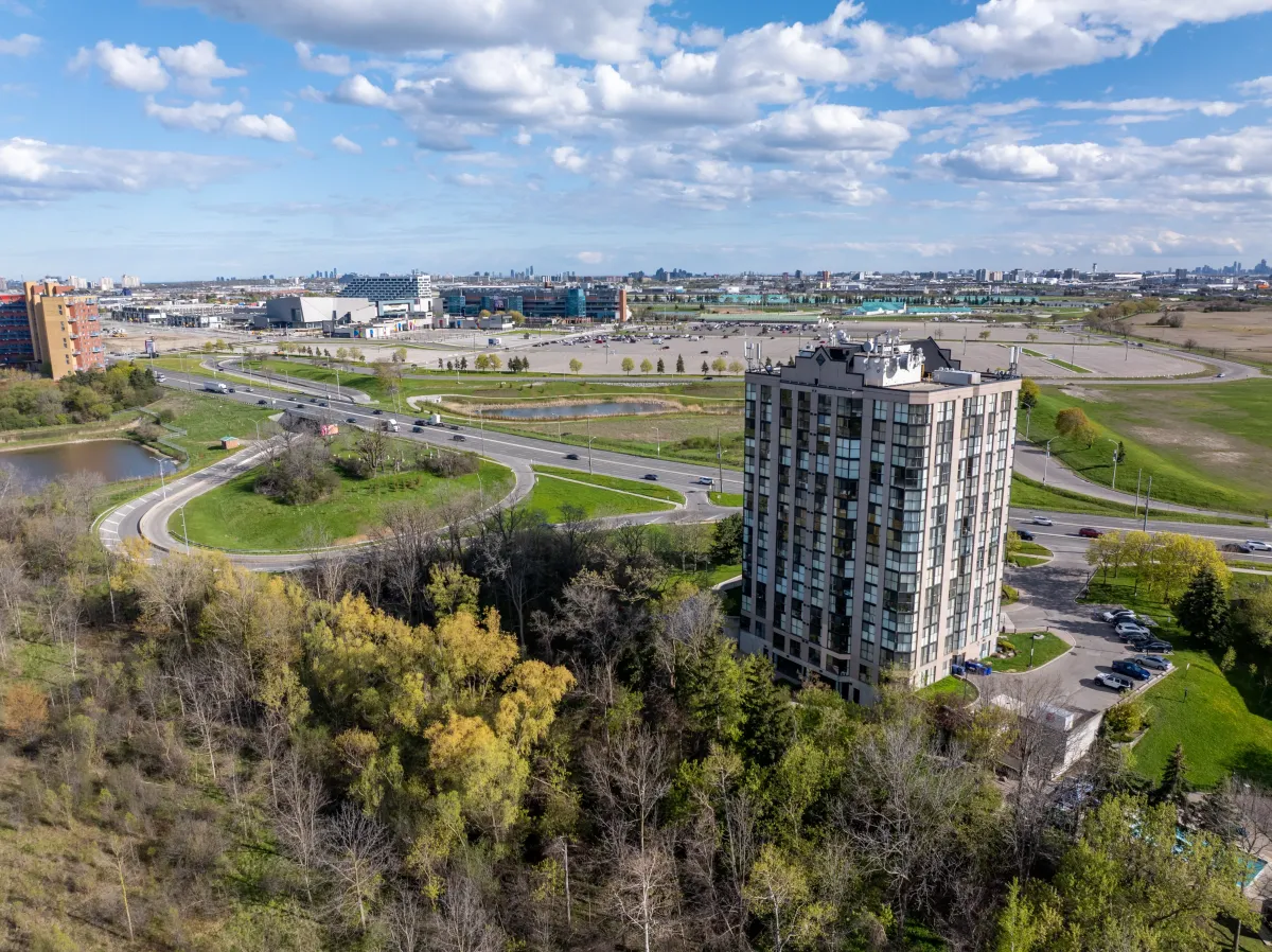High-altitude shot showcasing the building's location amidst lush greenery.