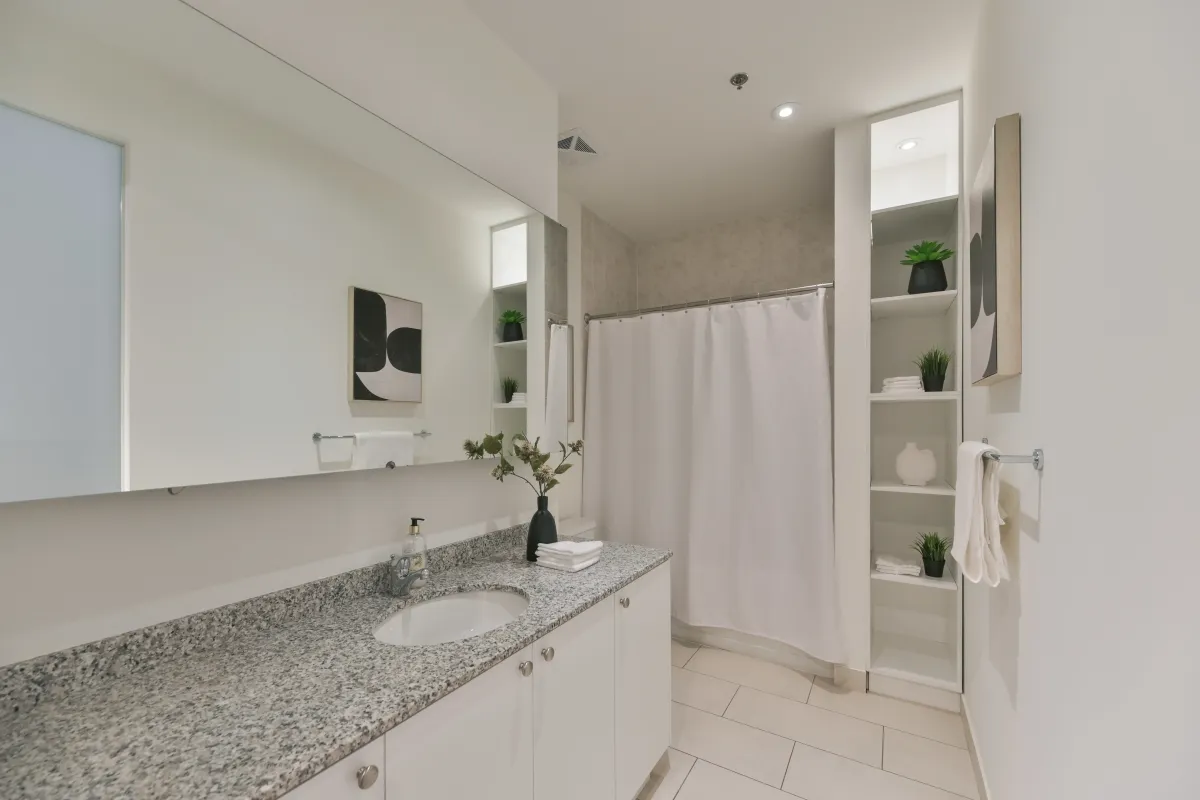 Bright and cozy bedroom setup with high ceilings and modern lighting at 61843 Hanna Ave.