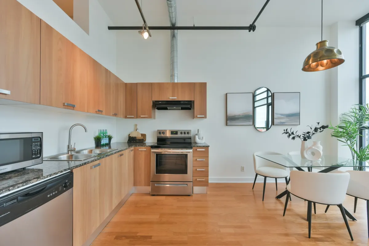 Modern kitchen featuring wood cabinets and stainless steel appliances at 61843 Hanna Ave.