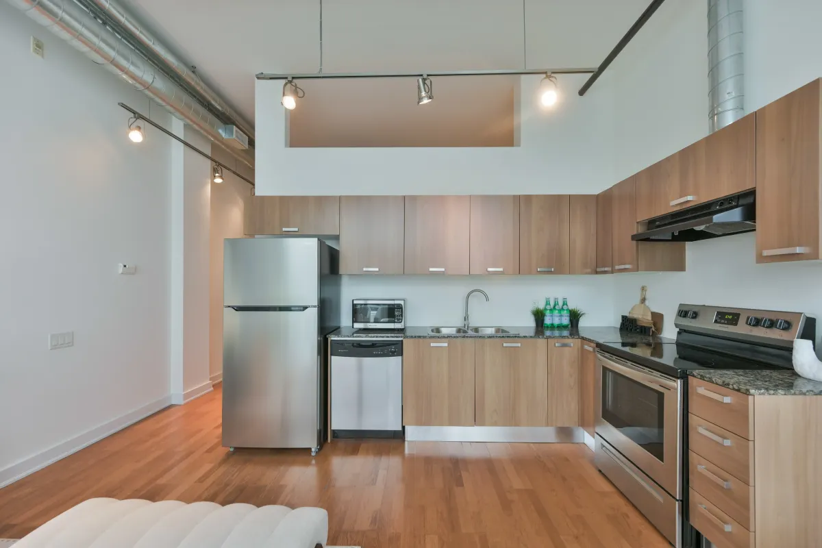 Contemporary kitchen setup with built-in stainless steel appliances at 61843 Hanna Ave.