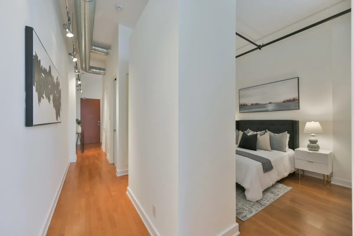 Clean interior corridor view looking toward the bedroom area at 61843 Hanna Ave.