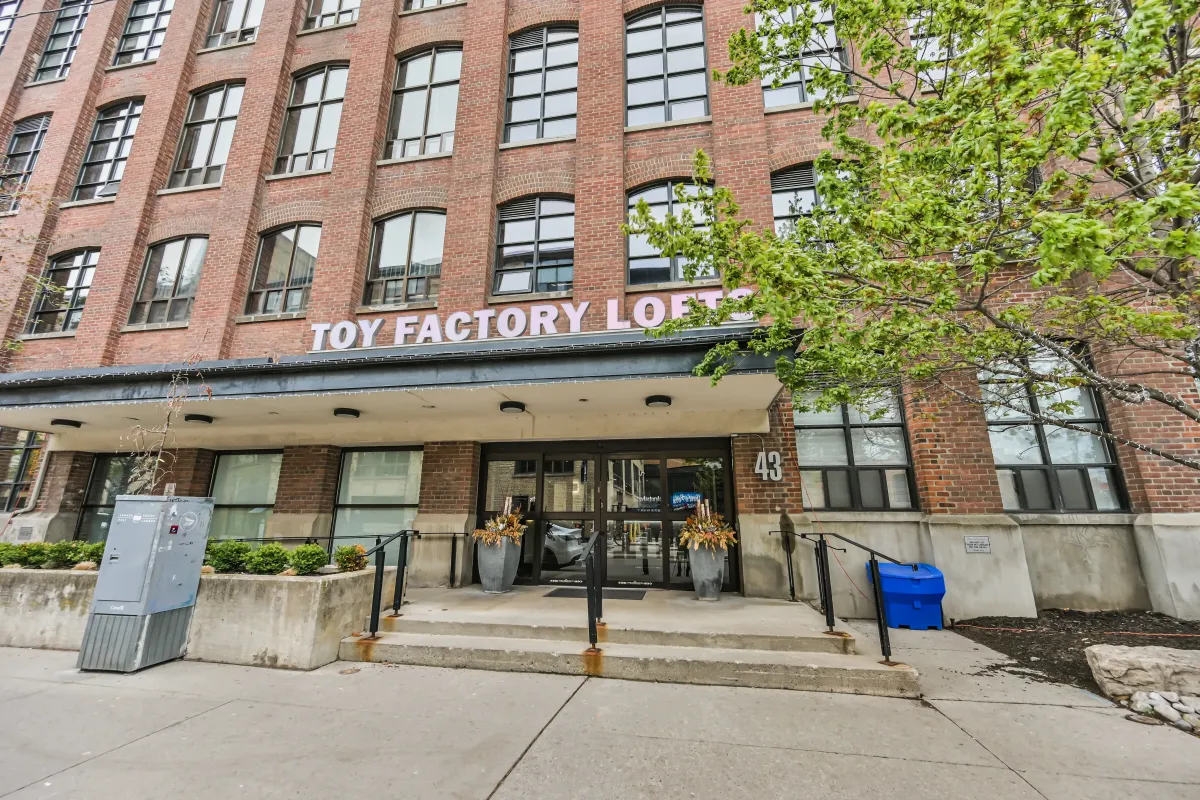 Front main entrance and canopy of the Toy Factory Lofts building at 61843 Hanna Ave.