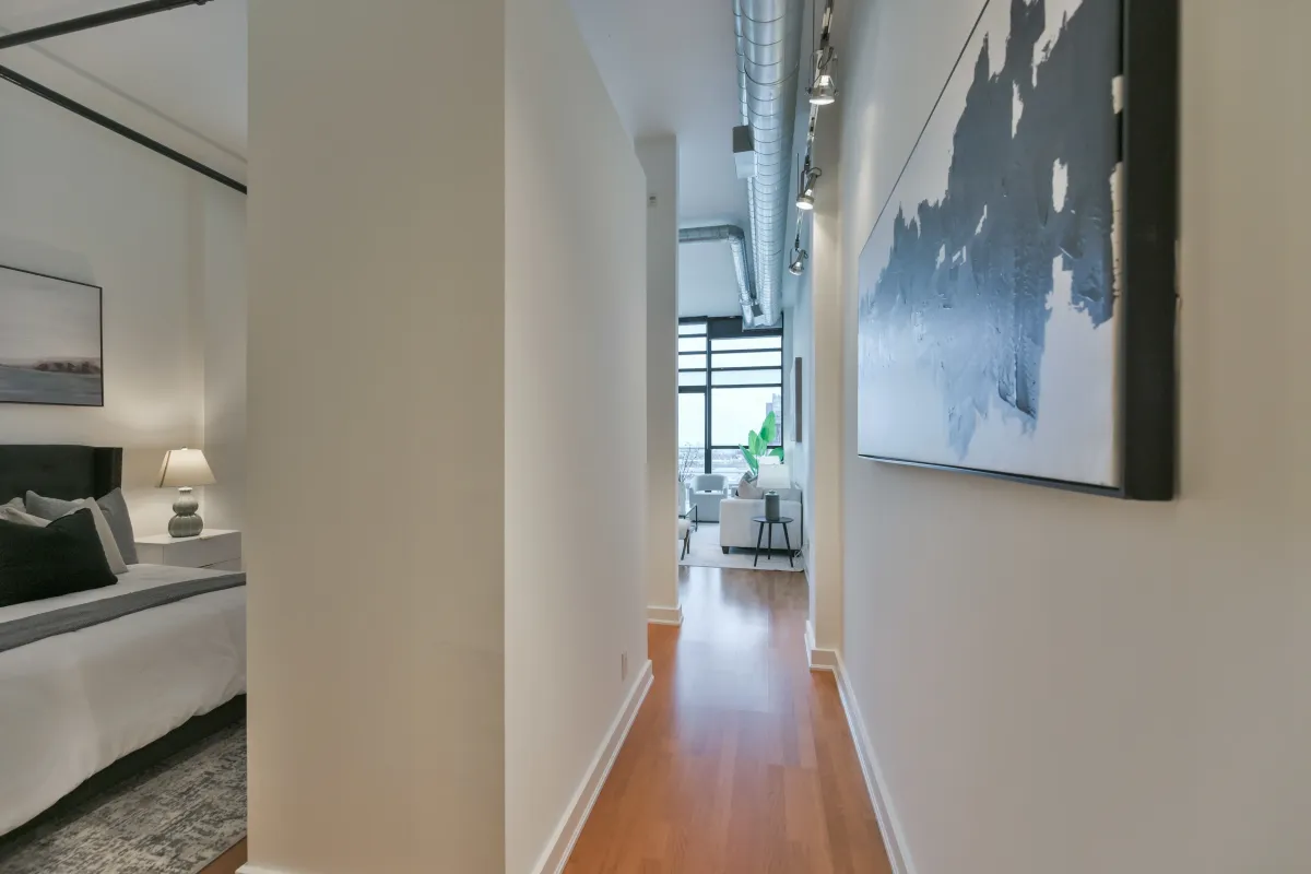 View from the inner hallway looking out toward the bright living area at 61843 Hanna Ave.