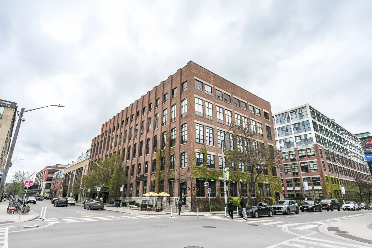 Exterior street view of the historic Toy Factory Lofts building at 61843 Hanna Ave.