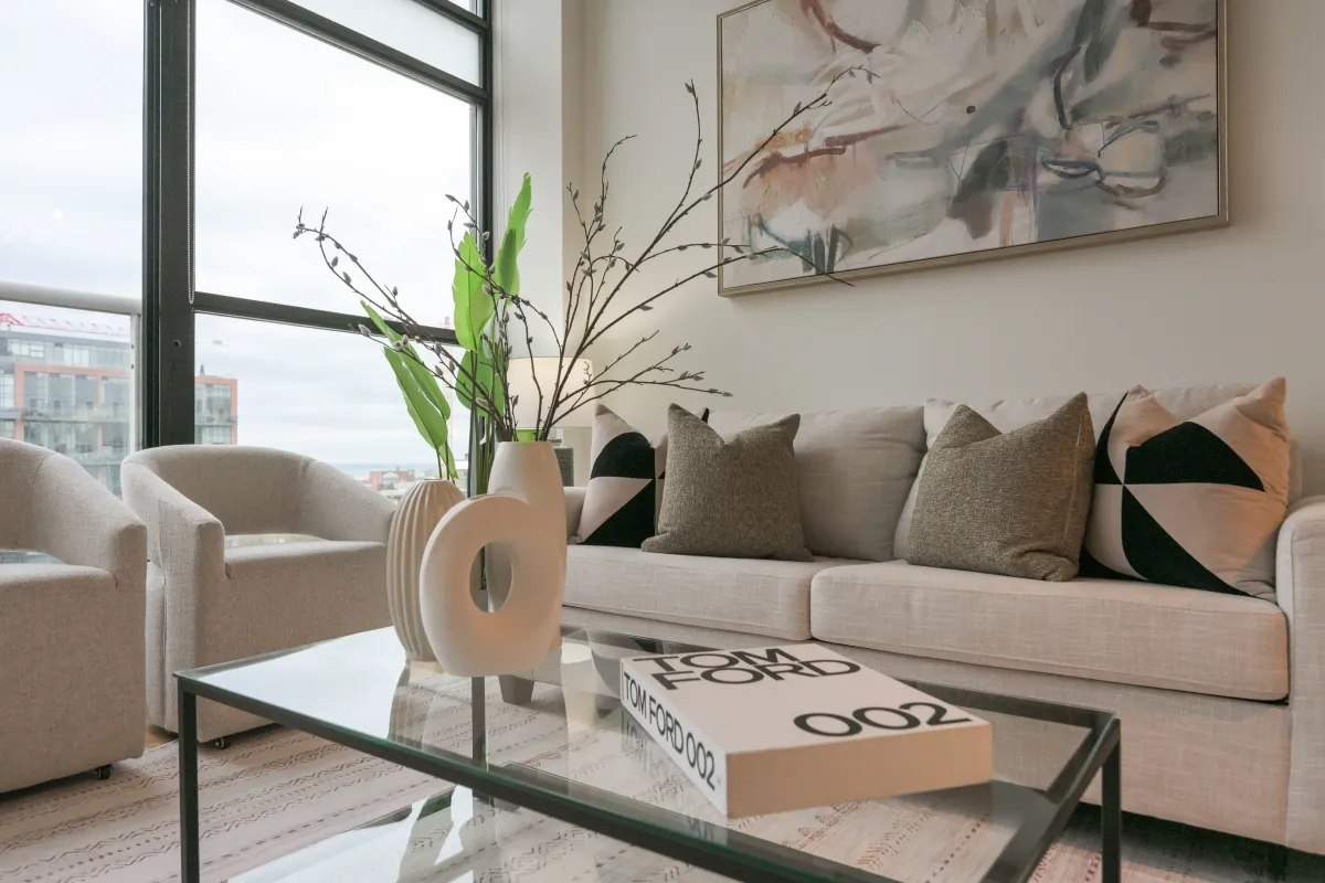 Close-up of the stylish living room seating and modern decor accents at 61843 Hanna Ave.