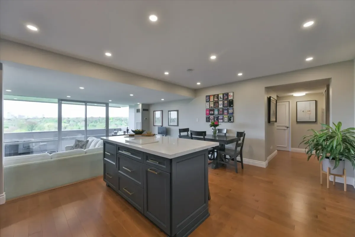 Wide view of the open living room and kitchen island at 240 Scarlett Rd #912 showing abundant natural light.