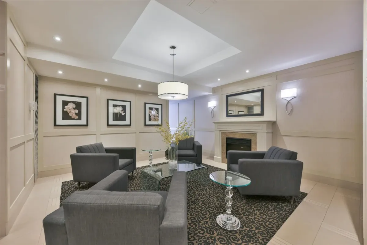 Elegantly decorated building lobby seating area at 240 Scarlett Rd #912 with modern armchairs and artwork.