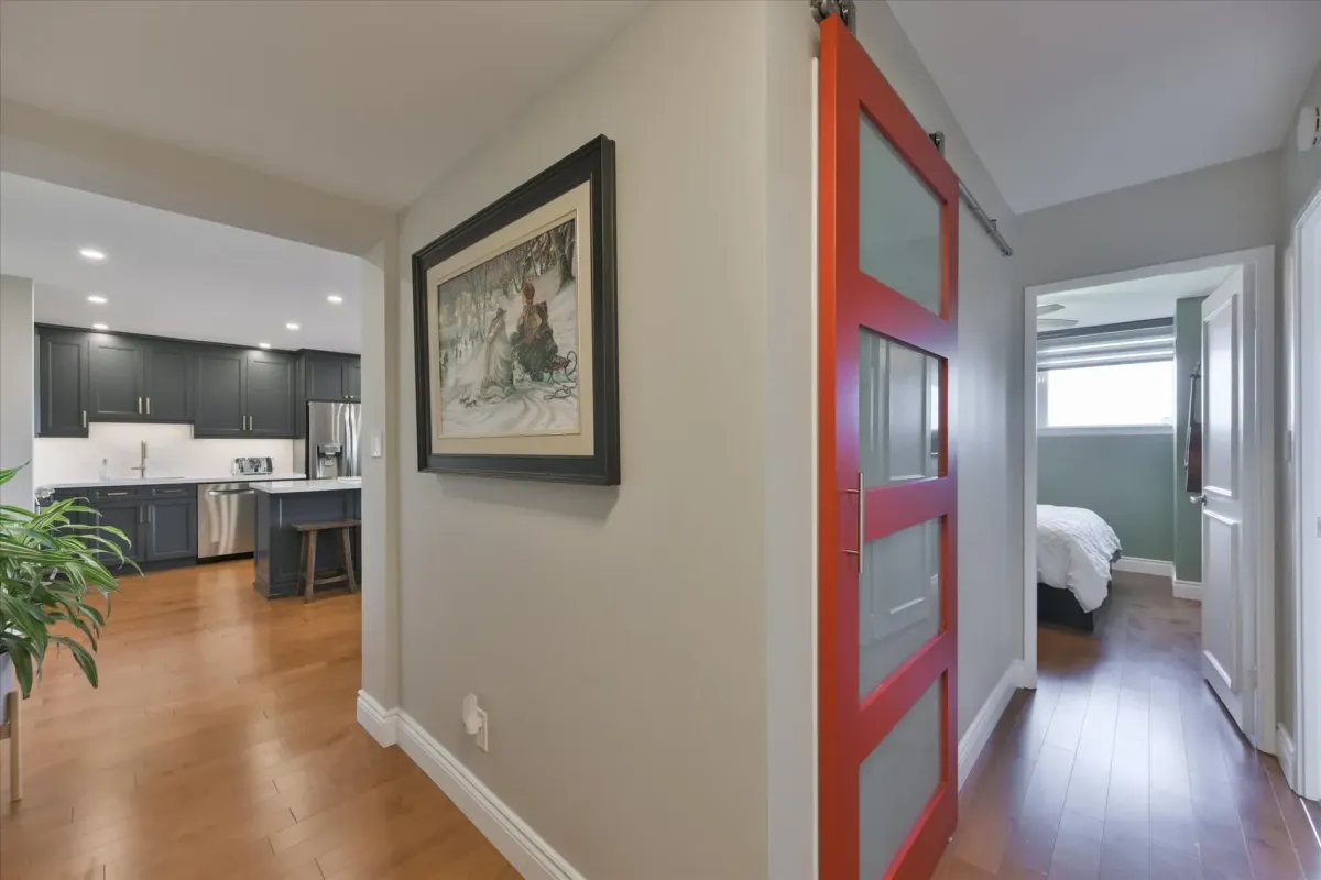 Interior hallway view at 240 Scarlett Rd #912 showcasing a modern red sliding barn door feature.