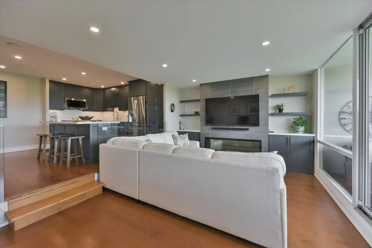 Modern living room layout at 240 Scarlett Rd #912 featuring a custom accent wall with an integrated linear fireplace and TV mount.