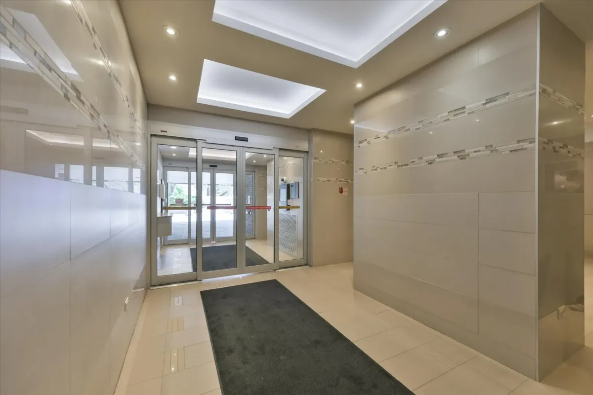 Secure glass sliding doors at the main interior entrance lobby of 240 Scarlett Rd #912.
