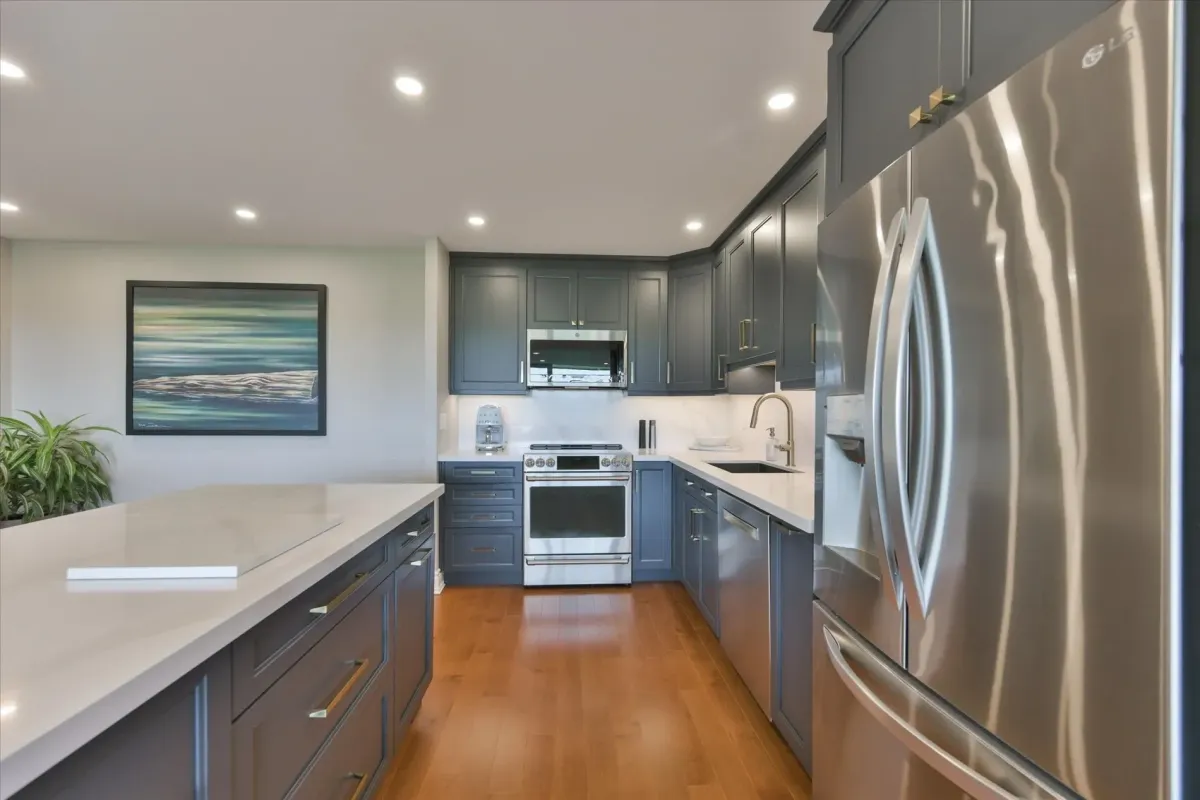 Modern kitchen details at 240 Scarlett Rd #912 highlighting the built-in microwave, stove, and quartz countertops.