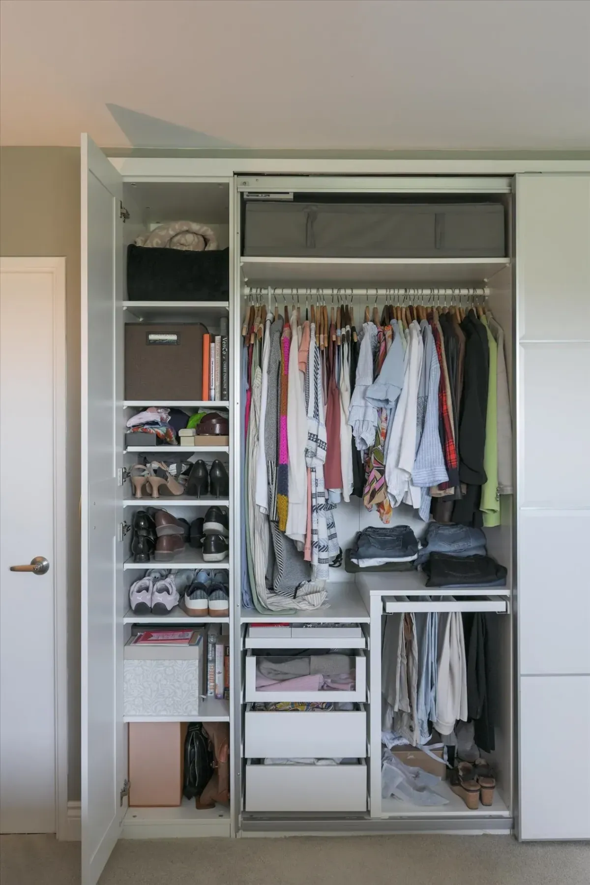 Interior view of a highly organized walk-in closet at 240 Scarlett Rd #912 with custom shelves and hanging storage.