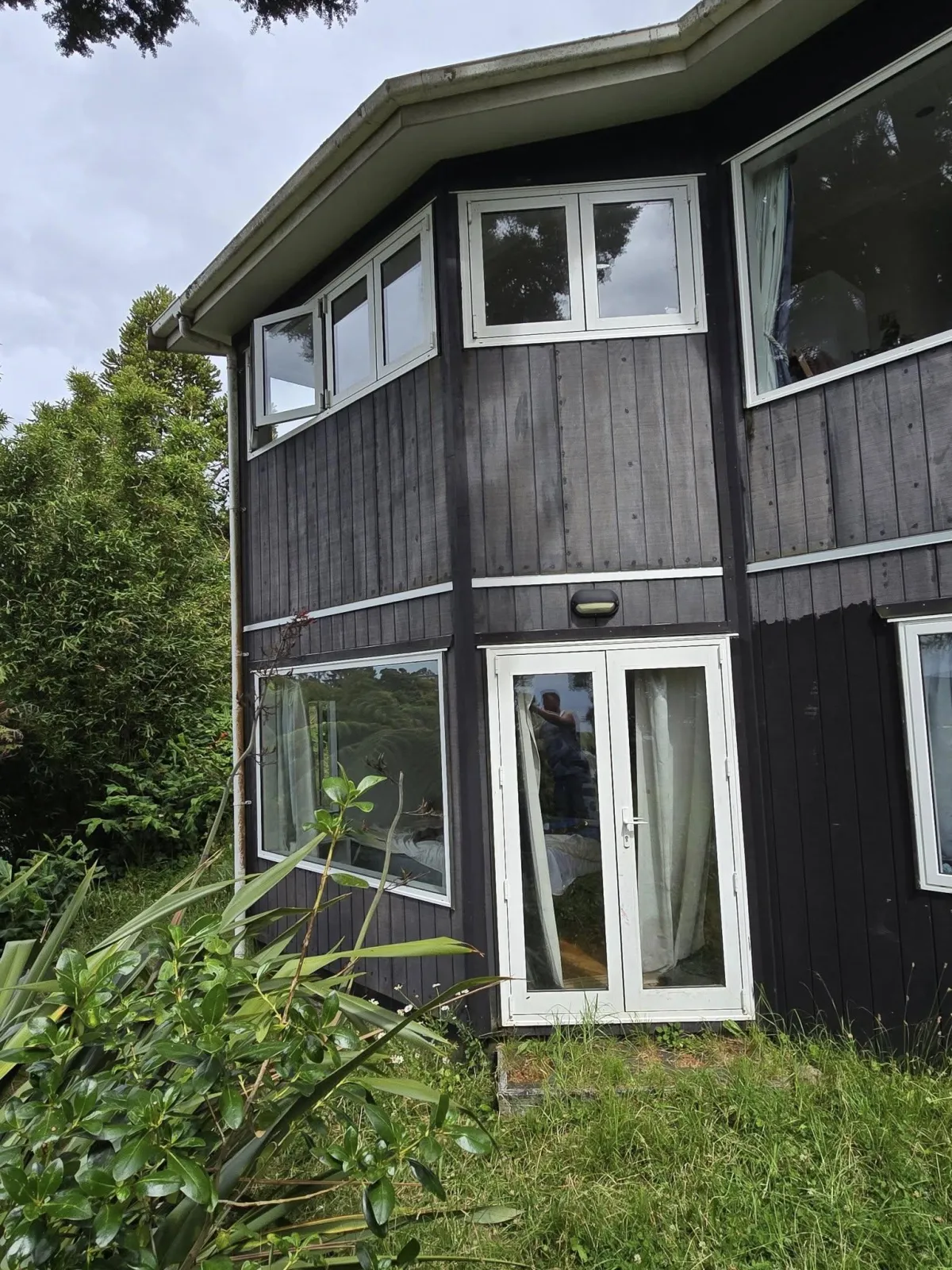 newly painted black exterior on modern home	