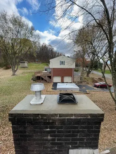 Lock Top Damper installed on a chimney in the open position